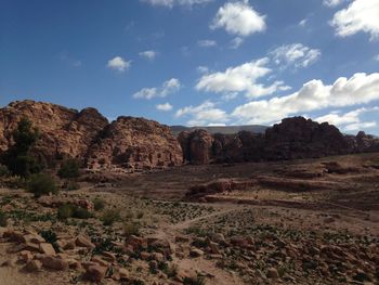 Rock formations on landscape against sky