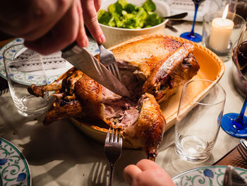 Midsection of man preparing food on table