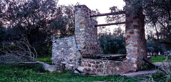 Abandoned building against trees