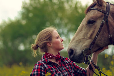 Young woman with horse