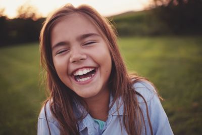 Close-up of happy girl at park