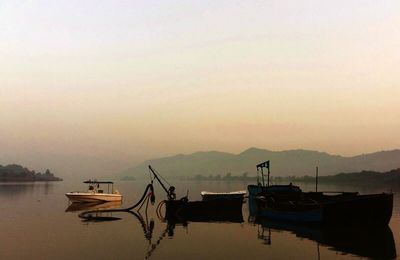 Scenic view of lake at sunset