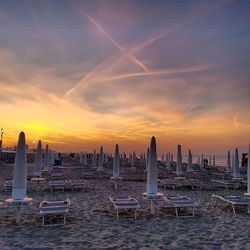 Scenic view of beach against sky during sunset