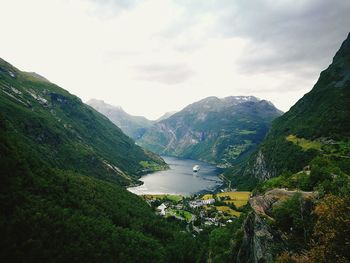 Scenic view of landscape and mountains against sky