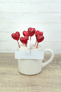 Close-up of red roses on table