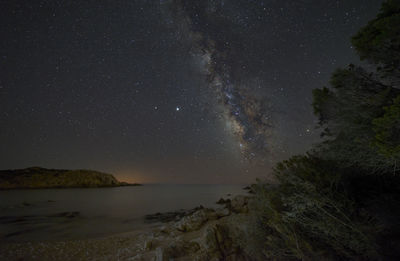 Scenic view of sea against sky at night