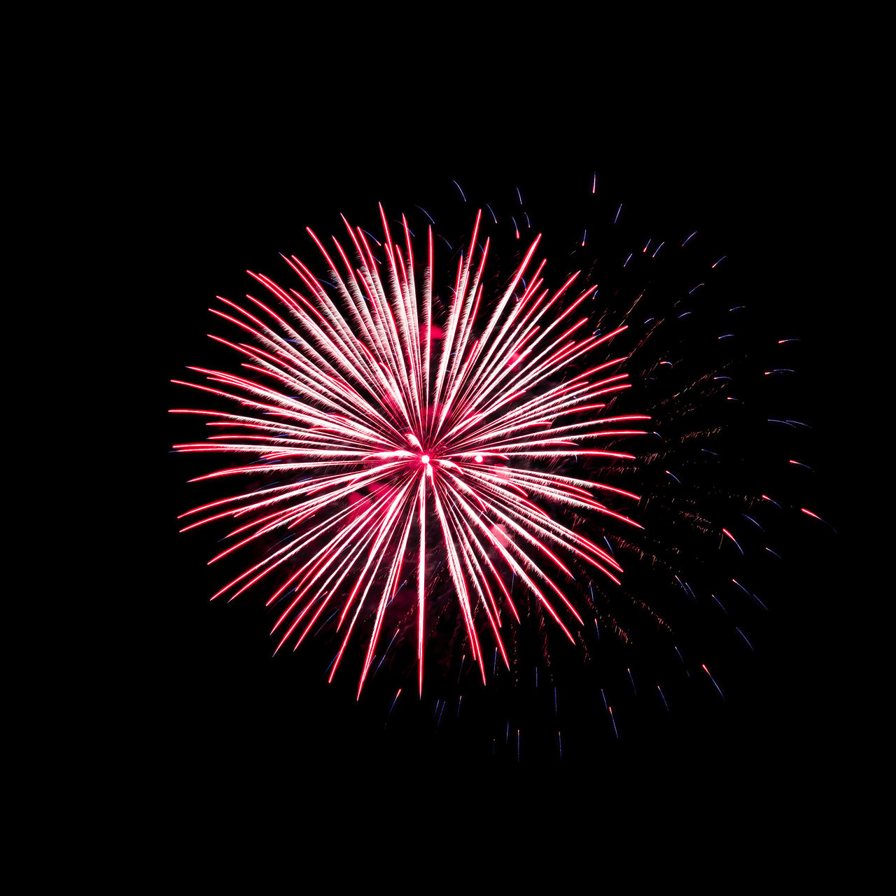 fireworks, exploding, firework display, celebration, motion, night, event, illuminated, arts culture and entertainment, no people, glowing, sky, firework - man made object, multi colored, long exposure, low angle view, nature, recreation, blurred motion, red, dark, outdoors, copy space, black