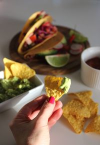 Close-up of hand holding food