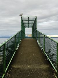 Steps by sea against sky