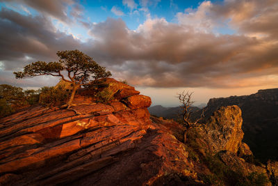 Scenic view of rock formation against sky during sunset