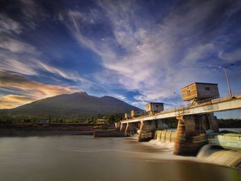 Cong dadong dam against cloudy sky during sunset