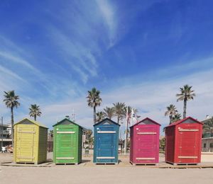 Beach huts against blue sky