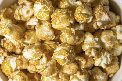 Popcorn in caramel top view close - up as background