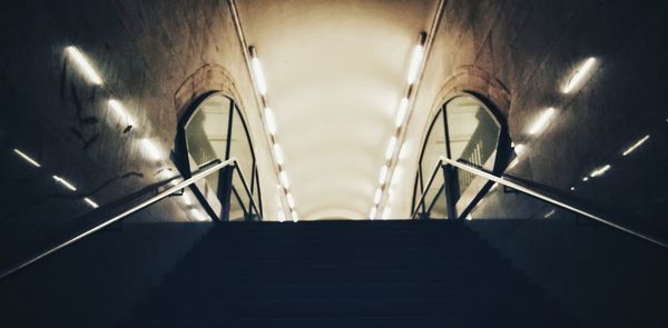 Low angle view of illuminated staircase in building