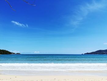 Scenic view of sea against blue sky