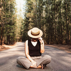 Full length of woman sitting in park