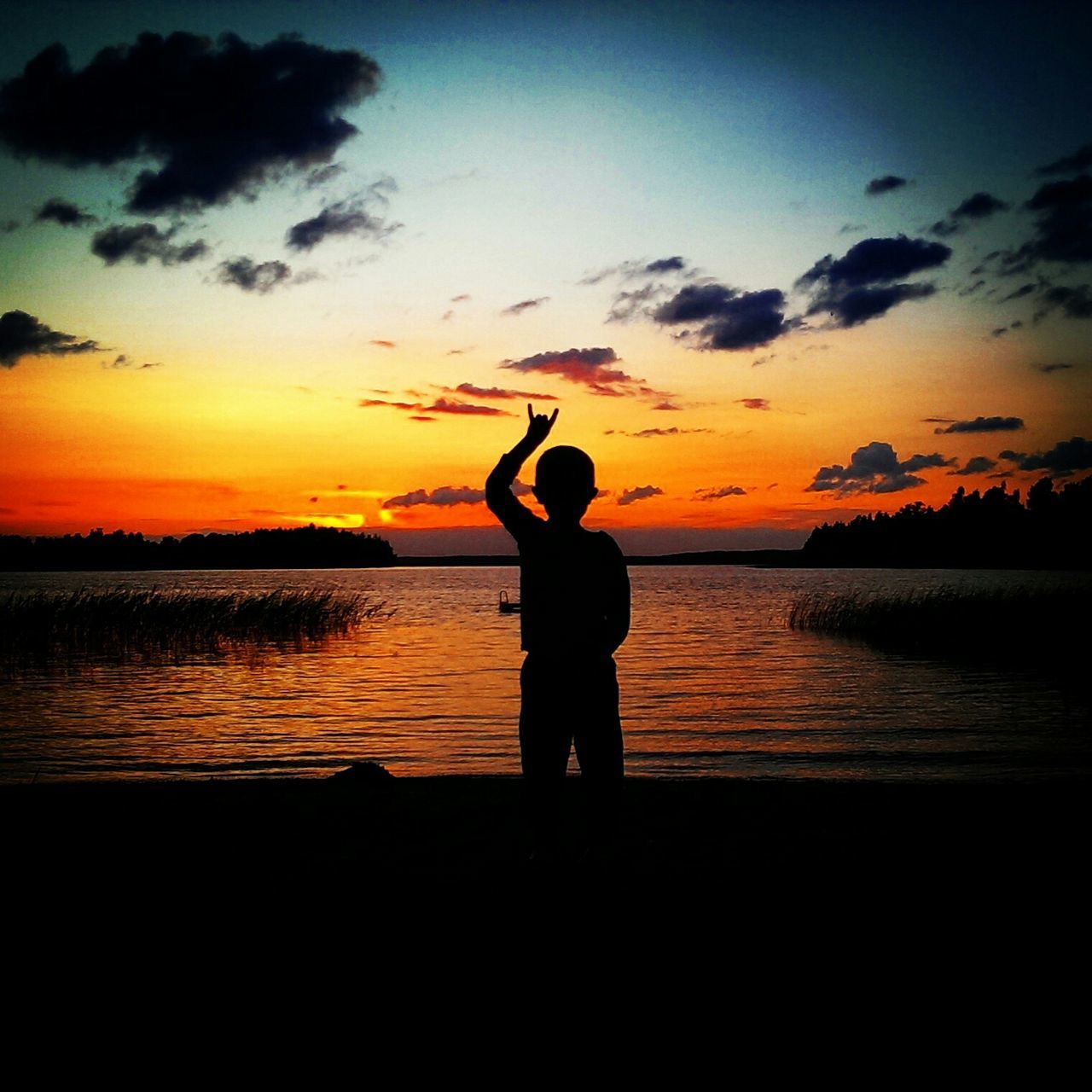 sunset, silhouette, water, sky, orange color, sea, scenics, standing, beauty in nature, tranquil scene, tranquility, leisure activity, lifestyles, idyllic, nature, horizon over water, cloud - sky, men