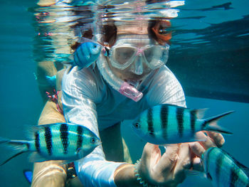 Portrait of woman swimming in sea