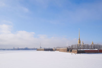 View of buildings against sky during winter