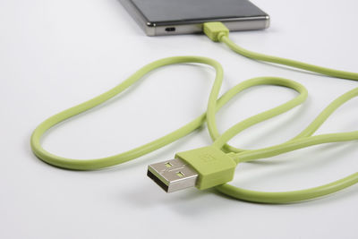 Close-up of laptop on table against white background