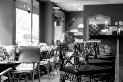 Empty chairs and table in restaurant