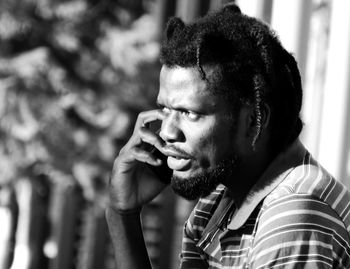 Portrait of young man looking away
