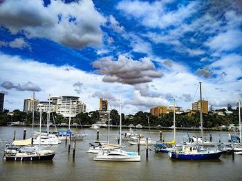 Boats moored at harbor