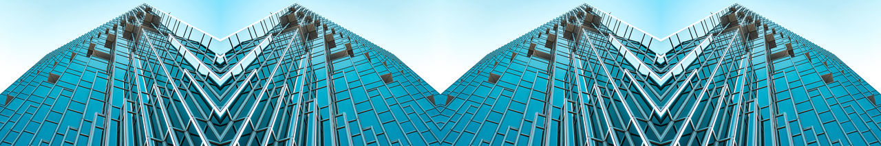 Low angle view of modern building against clear blue sky