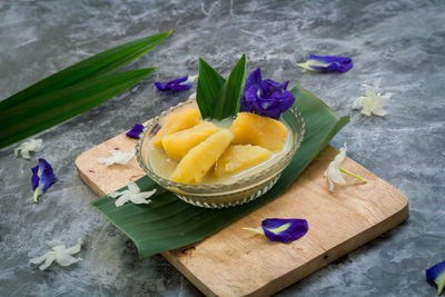 Close-up of purple and fruits on table