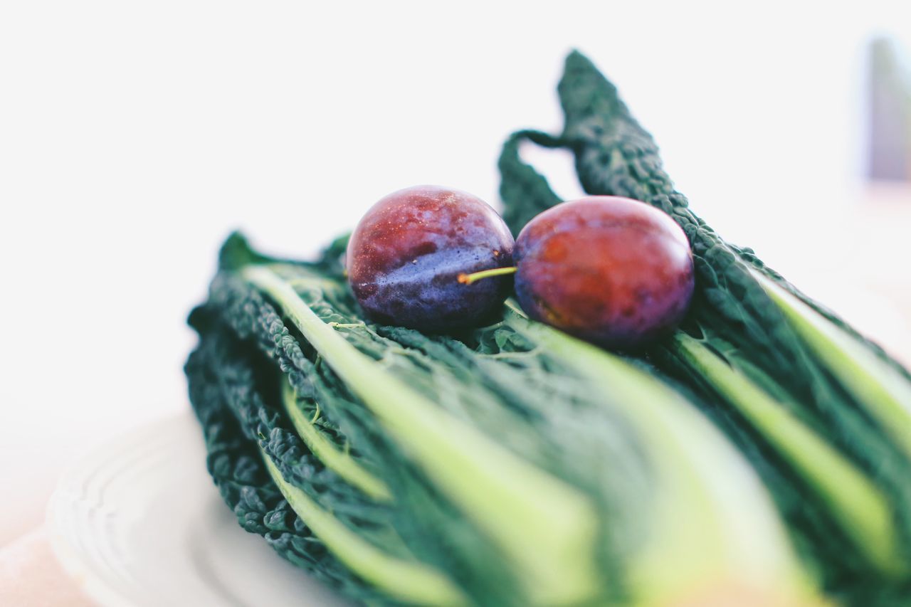 CLOSE-UP OF FRUITS ON WHITE BACKGROUND