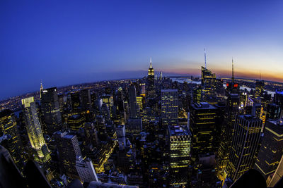 Illuminated buildings in city at night