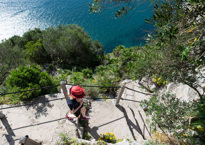 Teenage girl walking along the mediterranean steps footpath in gibraltar