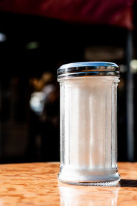 Close-up of glass jar on table