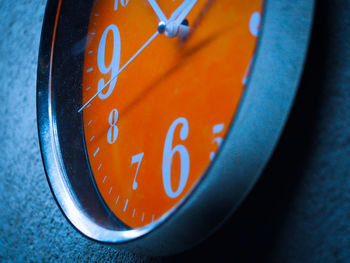 Low angle view of clock on wall