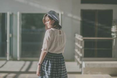 Full length of woman standing outdoors