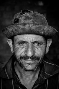 Close-up portrait of man wearing hat