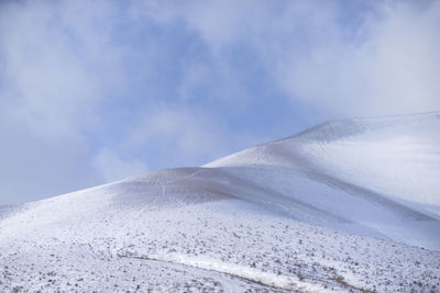 Scenic view of snowcapped mountain against sky