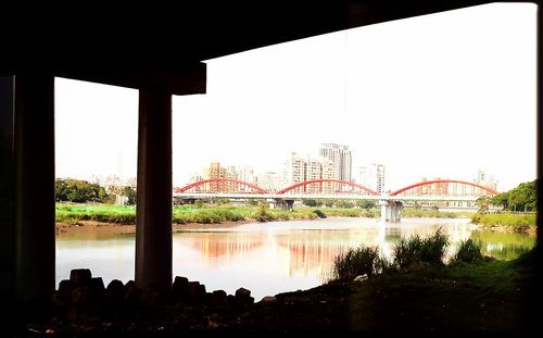 Bridge over river against sky