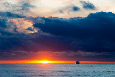 Scenic view of sea against sky during sunset