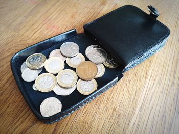 High angle view of coins on table