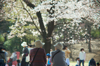 Woman holding flowers in park