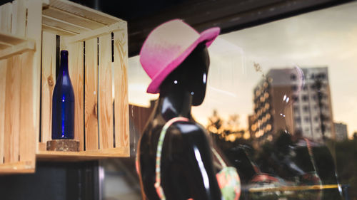 Portrait of woman standing in illuminated city