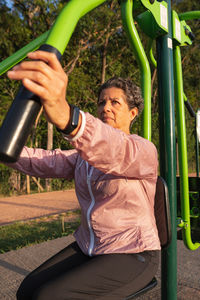 Full length of man holding slide in playground