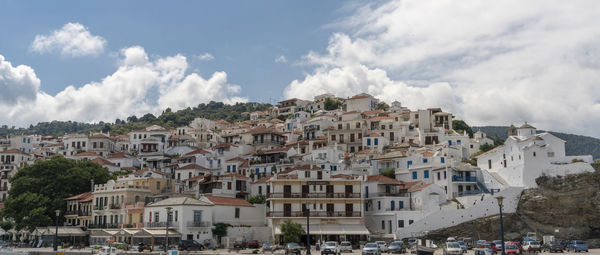 Buildings in town against sky