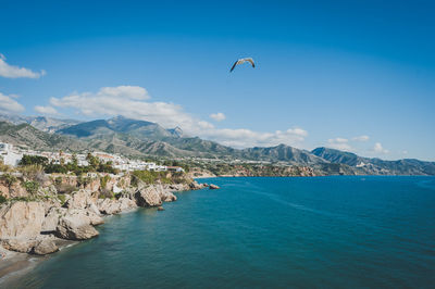 Scenic view of mountains against blue sky