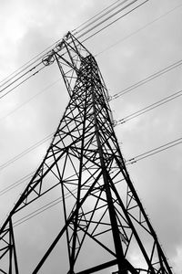 Low angle view of electricity pylon against sky