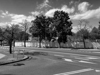 Empty road against cloudy sky