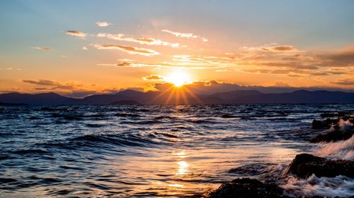 Scenic view of sea against sky during sunset