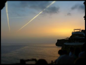 Scenic view of sea against sky at sunset