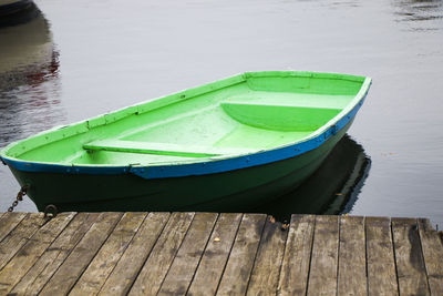 High angle view of boat moored on pier at lake